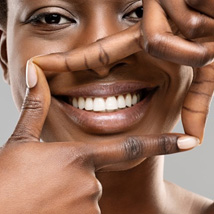 Woman outlining her smile with her fingers