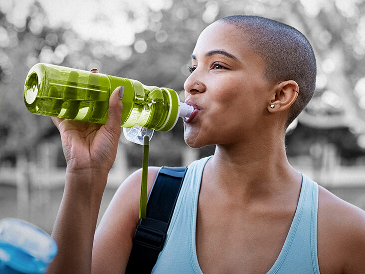 person drinking water with fluoride in it